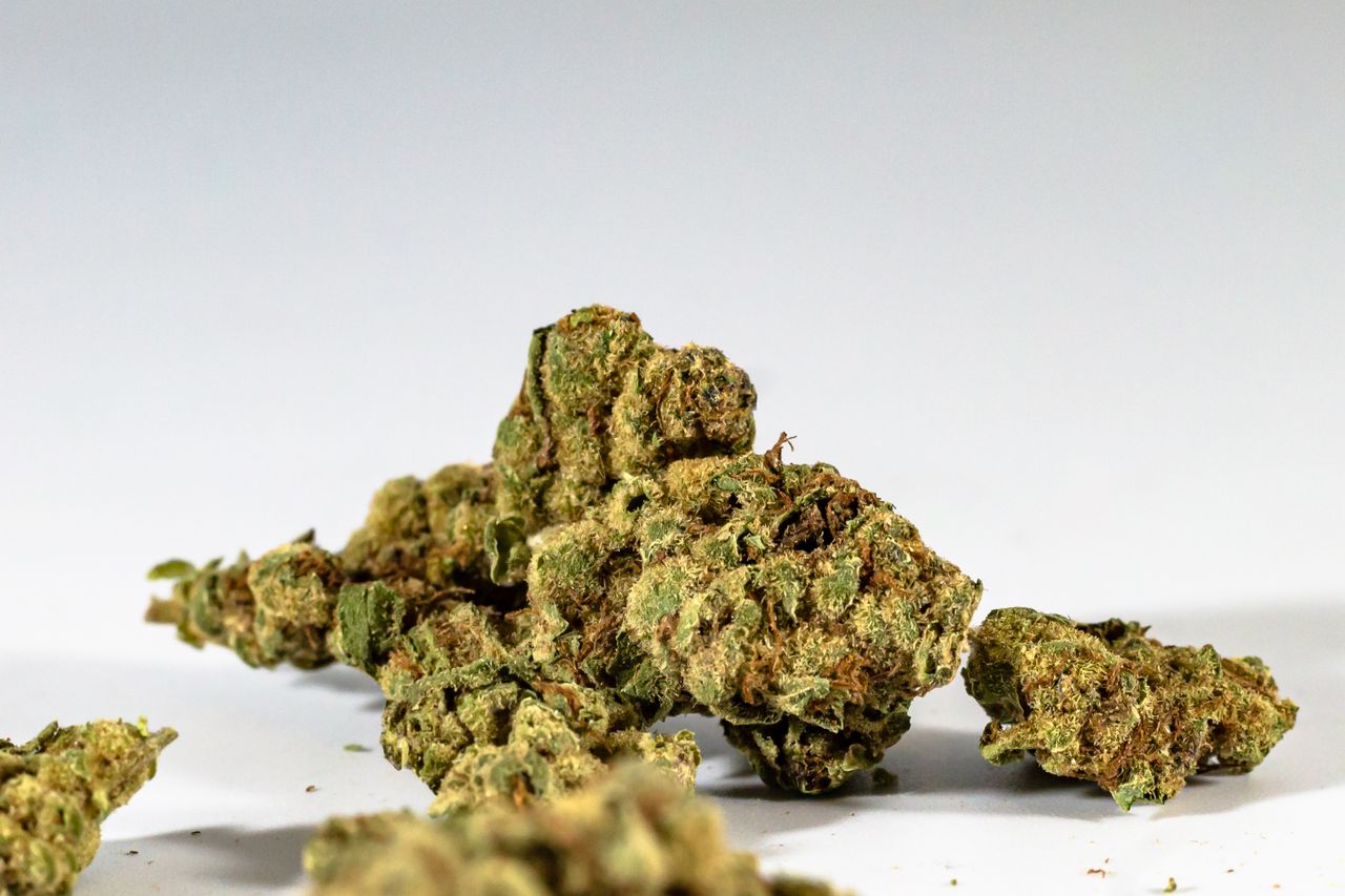 Detailed image of dried cannabis buds against a clean white background.